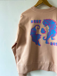 Circling tigers back print in misty pink