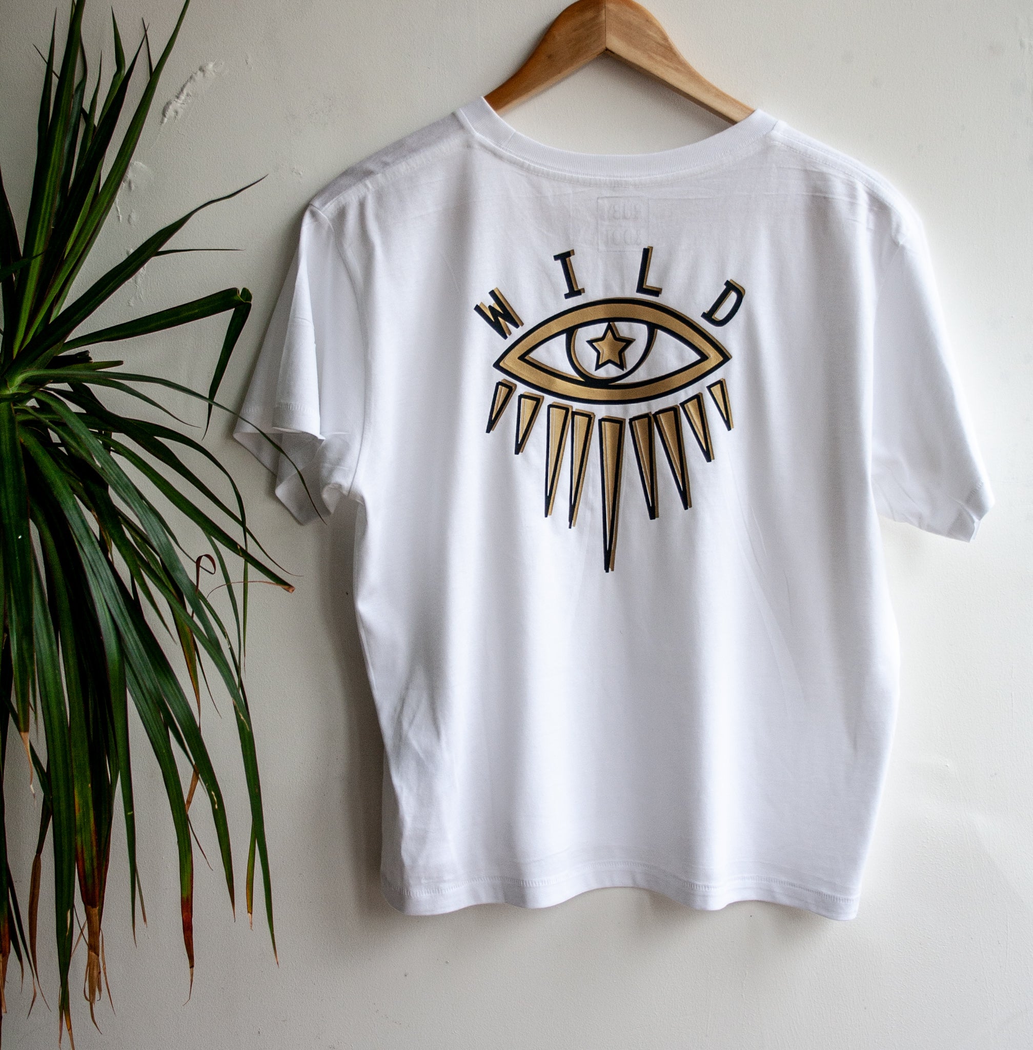 White Eye T-shirt with Black and Gold Design