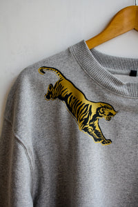 Grey sweater with black and gold flying tigers