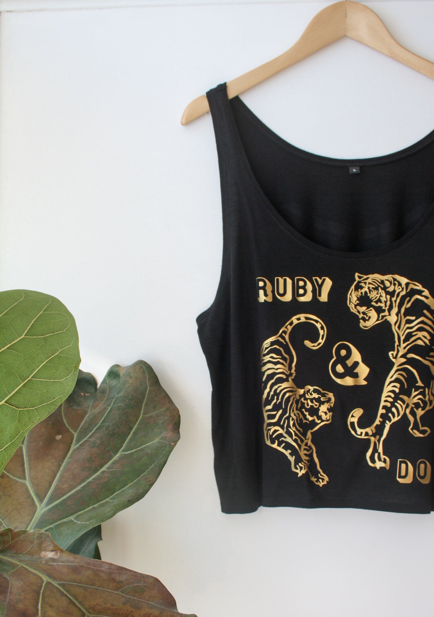 Black vest with gold circling tigers